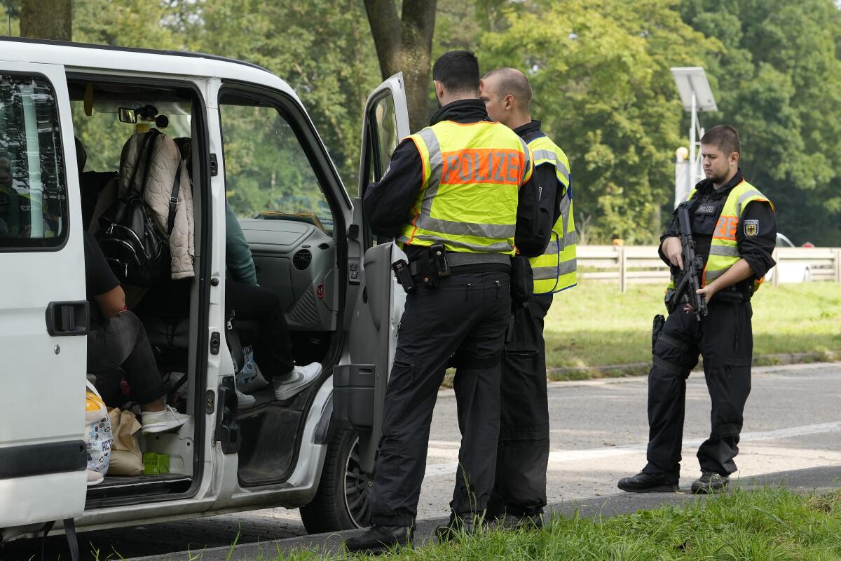 German police check the details of a van from Bulgaria near the border to Belgium in Aachen, Germany.