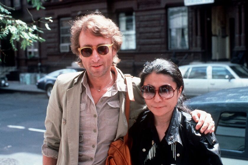 John Lennon and his wife, Yoko Ono, arrive at the Hit Factory, a recording studio in New York City, on Aug. 22, 1980.