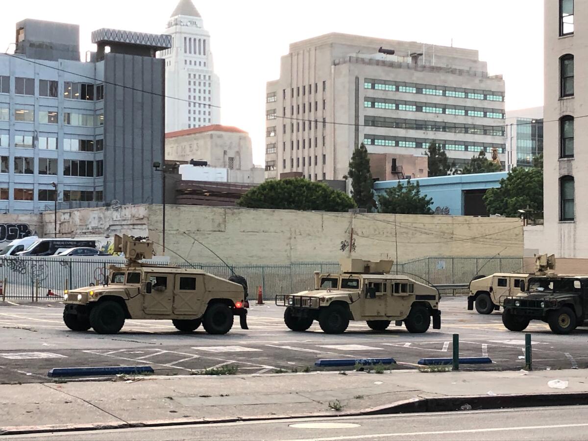 Humvees were parked in downtown L.A. as the National Guard began patrols.