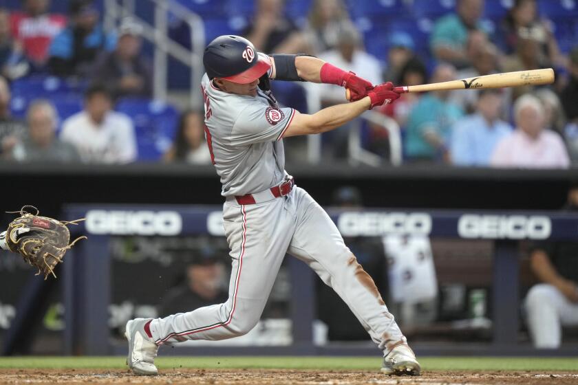 Washington Nationals' Jacob Young hits a single during the fifth inning of a baseball game against the Miami Marlins, Monday, April 29, 2024, in Miami. (AP Photo/Lynne Sladky)