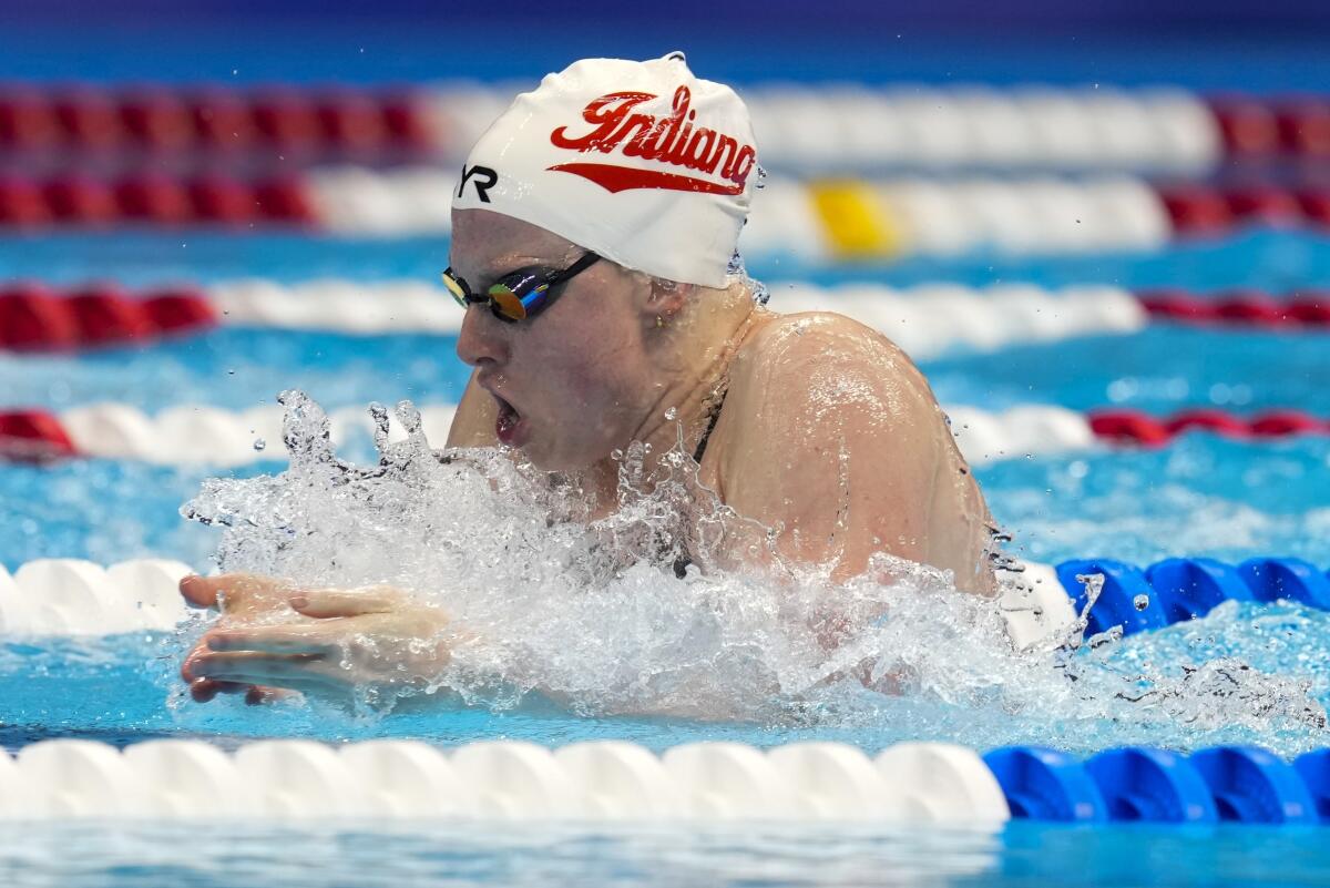 Lilly King swims during the women's 100 breaststroke finals.