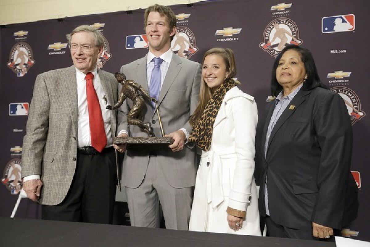 Clayton Kershaw with then-MLB chief Bud Selig, wife Ellen and Vera Clemente after winning the Robert Clemente Award.