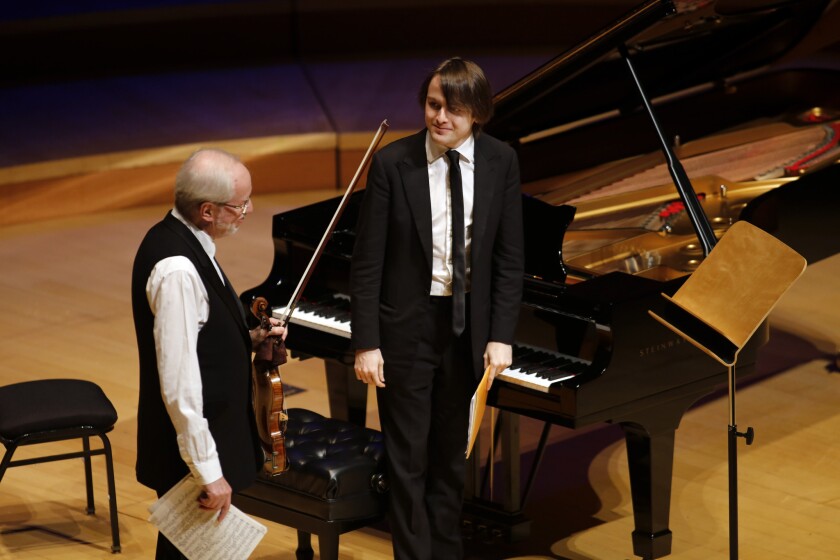 Daniil Trifonov, pictured with violinist Gidon Kremer at Walt Disney Concert Hall in January, will return Friday night for a much-anticipated recital.
