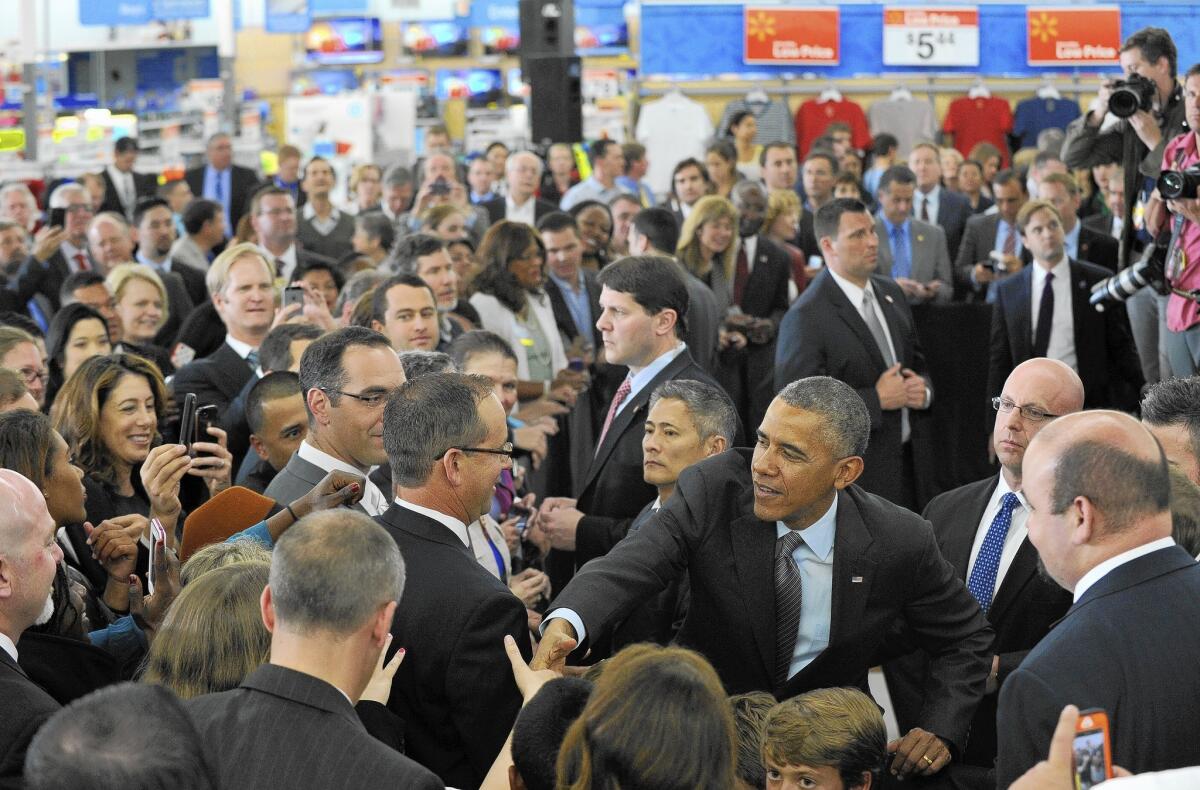 President Obama greets people at a Wal-Mart in Mountain View, Calif., where he announced a series of corporate pledges to increase renewable energy use.