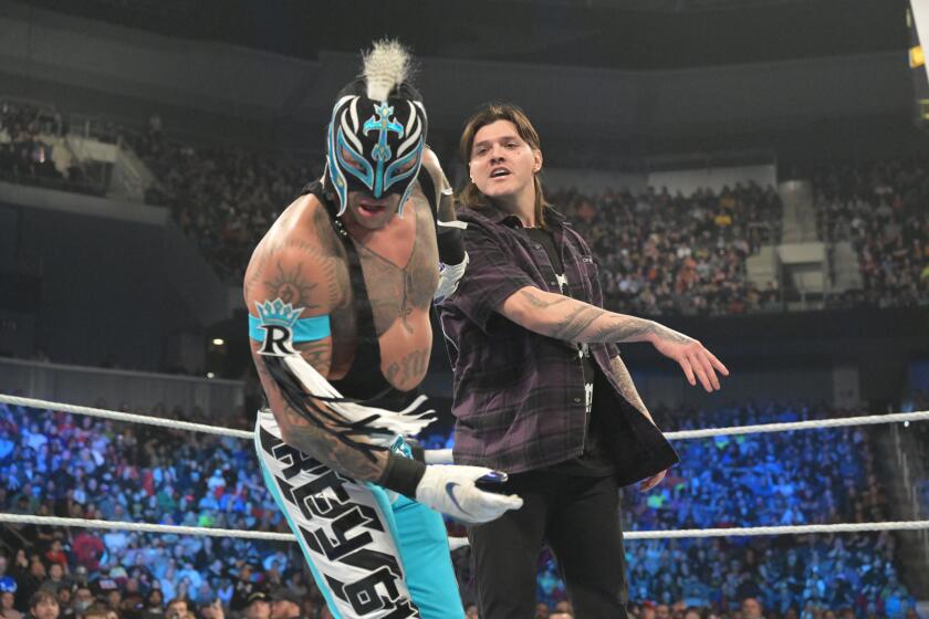 Rey Mysterio is slapped by his son Dominik during one of the most compelling WrestleMania story lines.