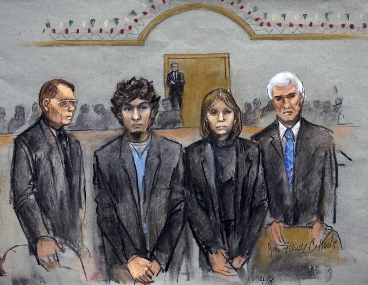 Dzhokhar Tsarnaev, second from left, stands with his attorneys as the jury declares him guilty in the Boston Marathon bombing.