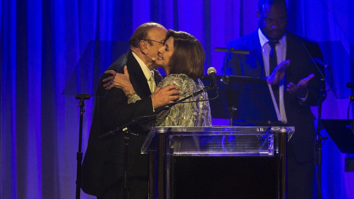 Clive Davis hugs Congresswoman Nancy Pelosi (D-CA) during the Pre-Grammy Gala & Grammy Salute to Industry Icon Debra Lee at the Beverly Hilton on Feb. 11, 2017 in Beverly Hills, Calif.