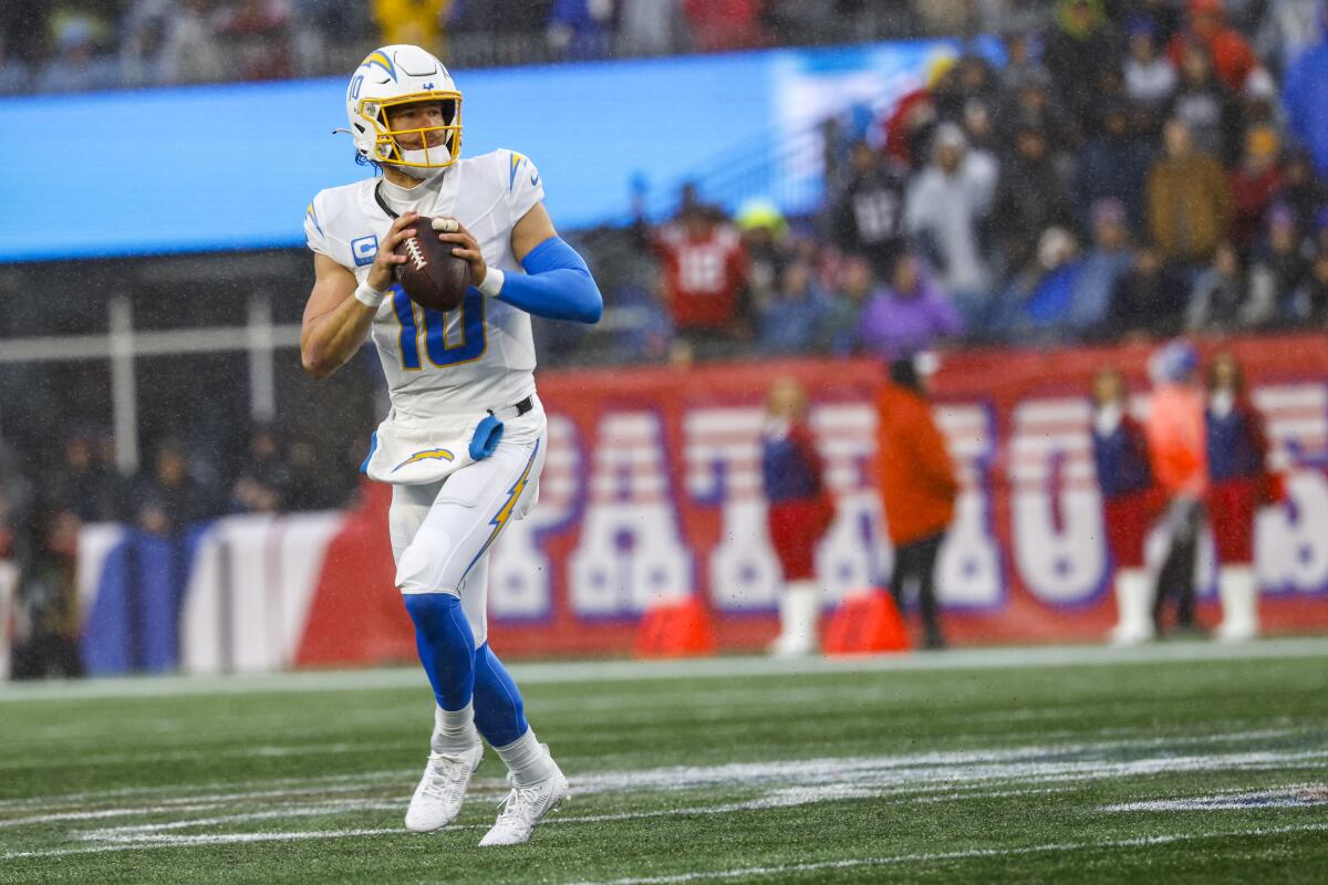 Chargers quarterback Justin Herbert (10) looks to throw against the Patriots in Week 13.