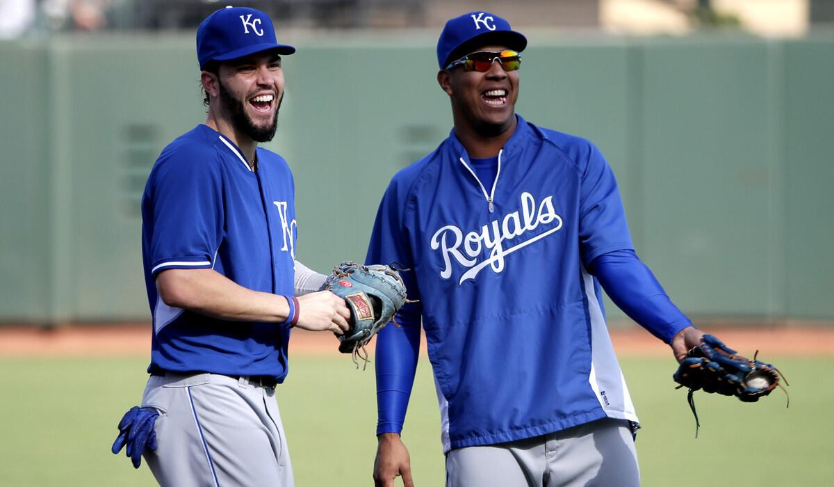 Royals first baseman Eric Hosmer, left, and catcher Salvador Perez share a laugh during a workout Thursday in San Francisco.