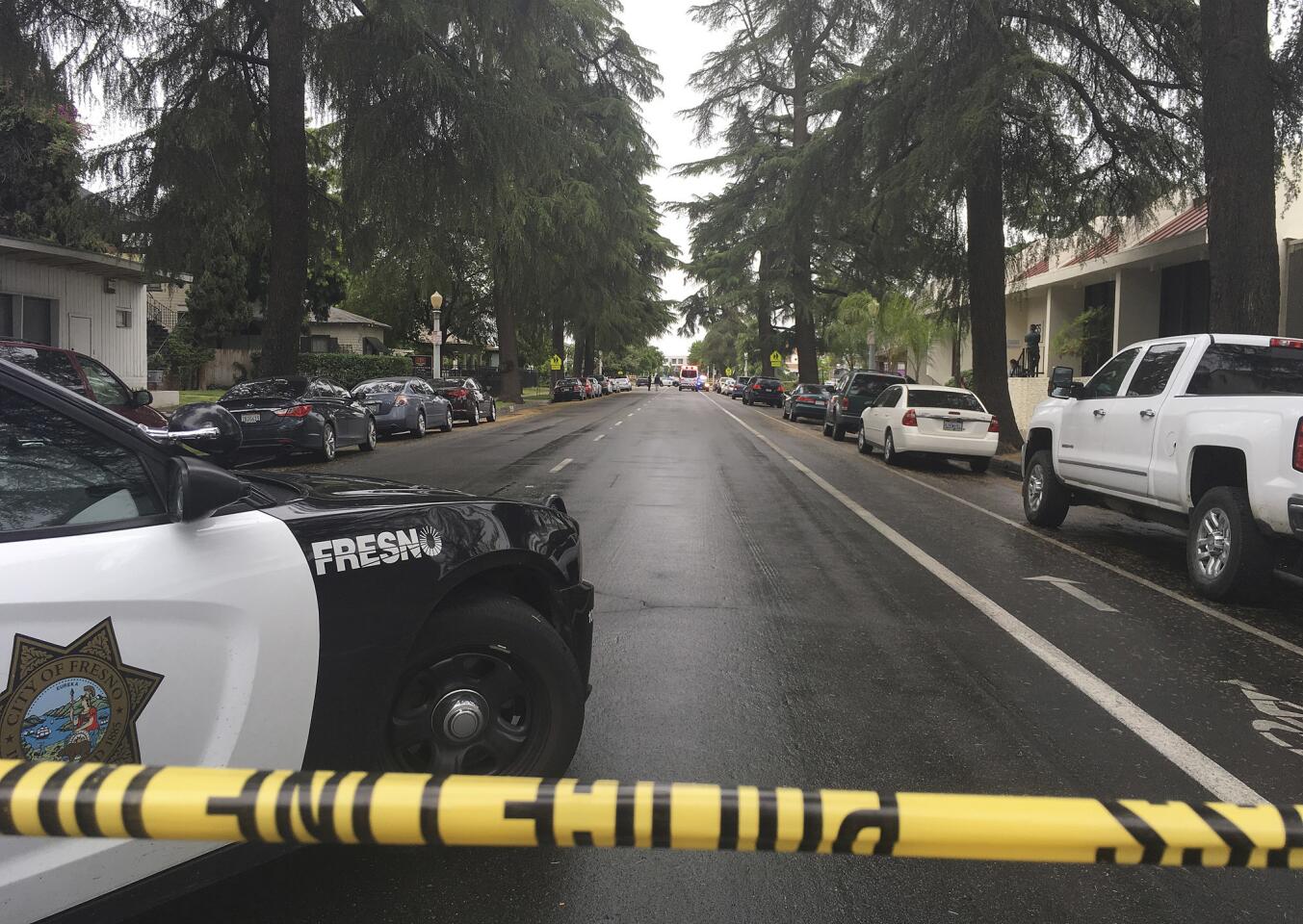 A street is blocked off in Fresno after a gunman shot and killed three people.