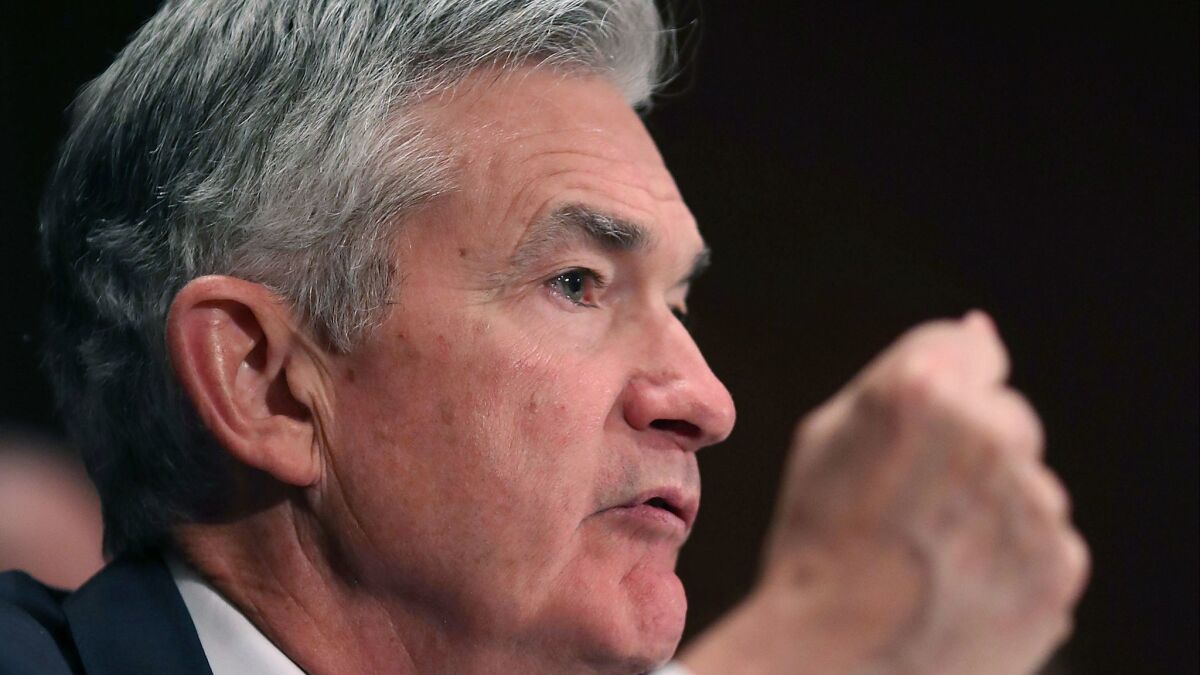 Federal Reserve Board Chairman Jerome H. Powell testifies at a Senate Banking Committee hearing on Thursday.