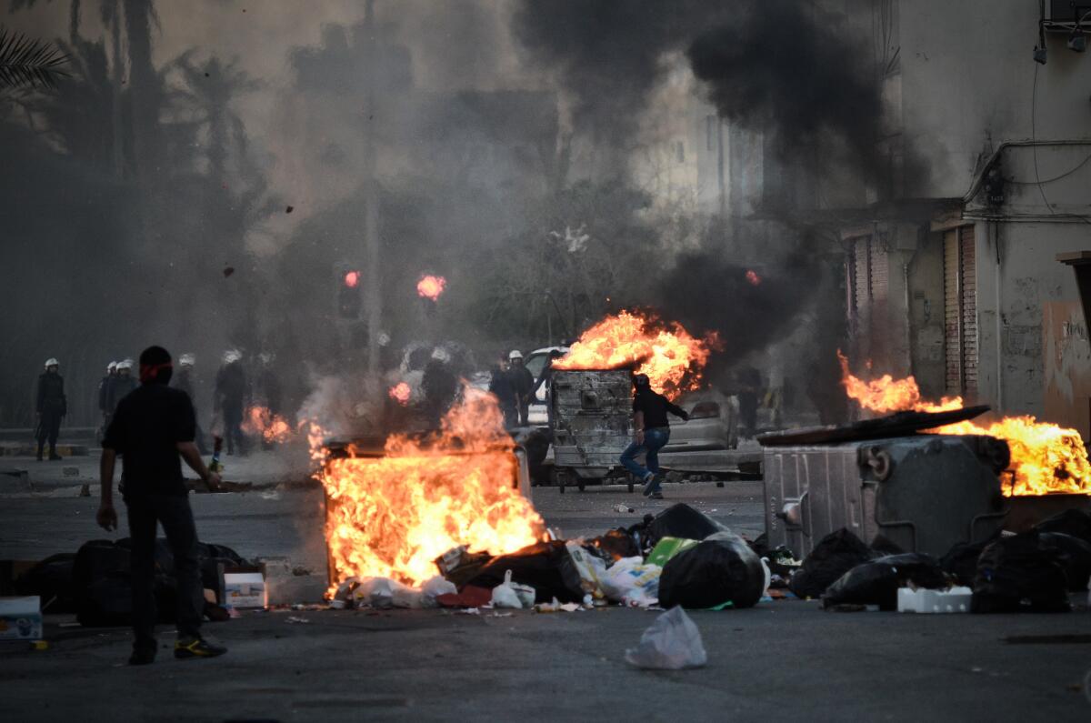 Protesters clash with security forces following a rally to mark the second anniversary of an uprising in Bahrain on Thursday in the village of Sanabis, west of Manama.