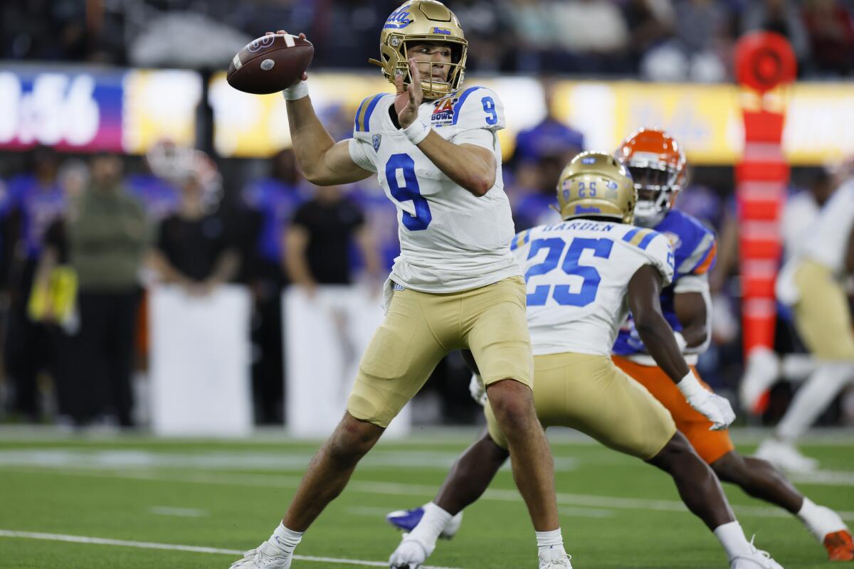 UCLA quarterback Collin Schlee passes against Boise State in the first half.