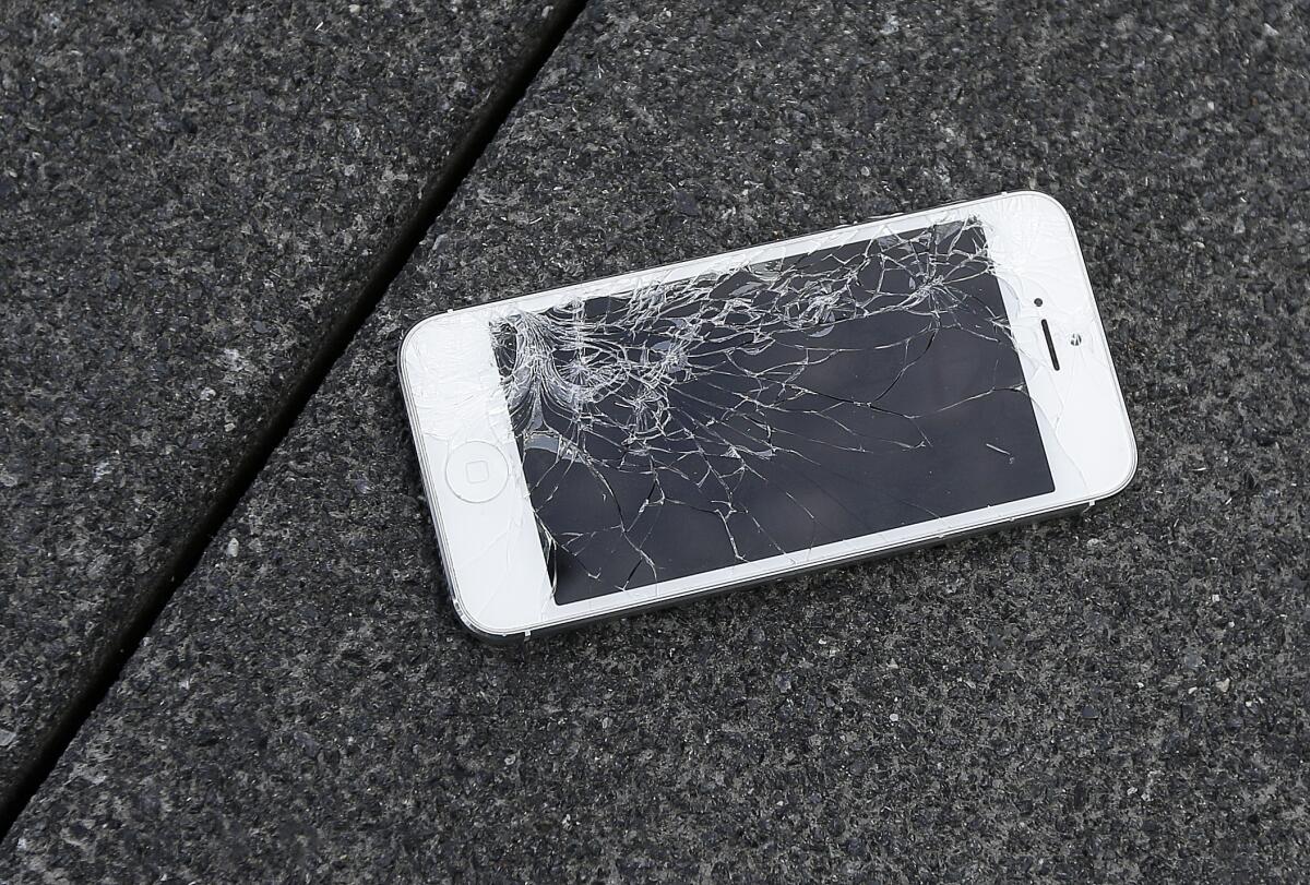 Apple iPhone with a cracked screen