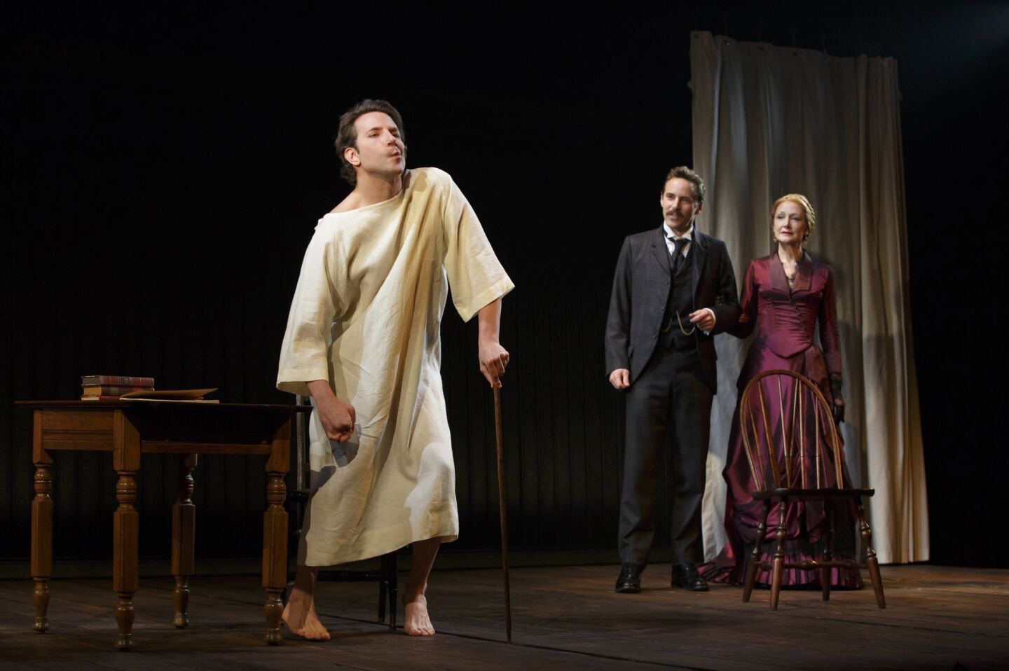 Bradley Cooper, left, Alessandro Nivola and Patricia Clarkson perform in "The Elephant Man" at the Booth Theatre in New York.
