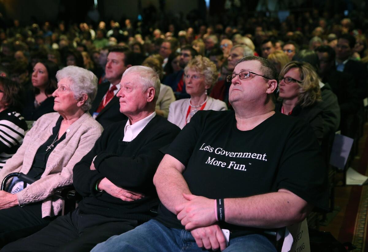 Audience members listen to GOP presidential hopefuls at the Iowa Freedom Summit last month in Des Moines. The public gives the GOP an edge on many issues, but more see Democrats as tolerant and open.
