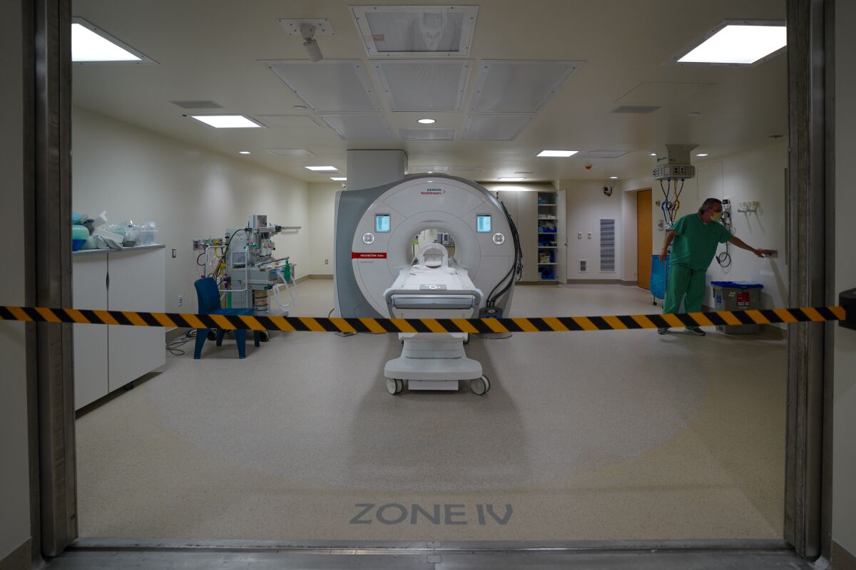 A worker can be seen inside the magnetic resonance imaging suite at Rady Children's Hospital.