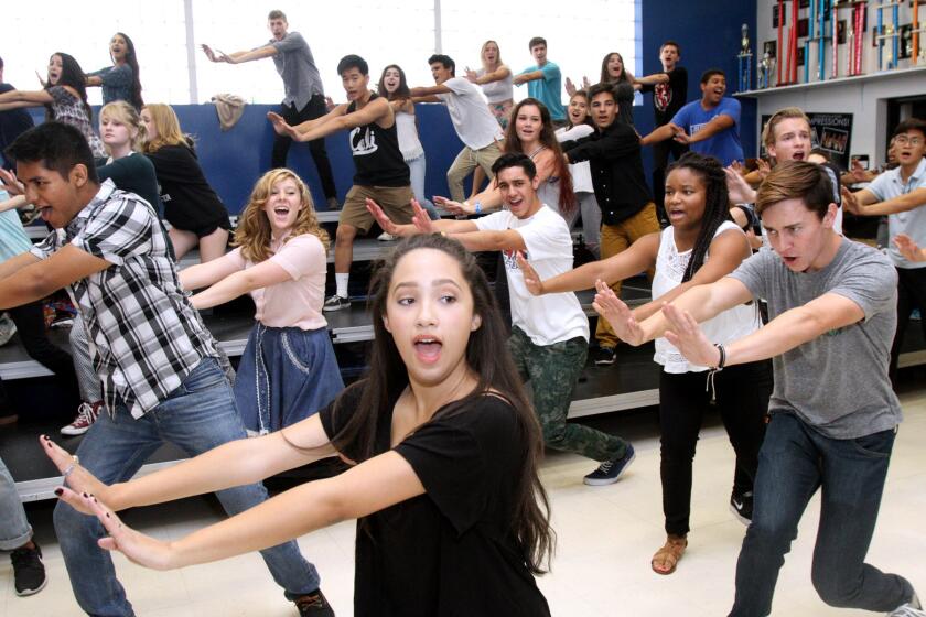 Burbank High School's Noa Drake, center, sings and dances along with the rest of the members of the school's show choir during practice at the school in Burbank on Tuesday, September 22, 2015. The choir will performed on stage with Megan Hilty on September 24 at the Valley Performing Arts Center in Northridge.