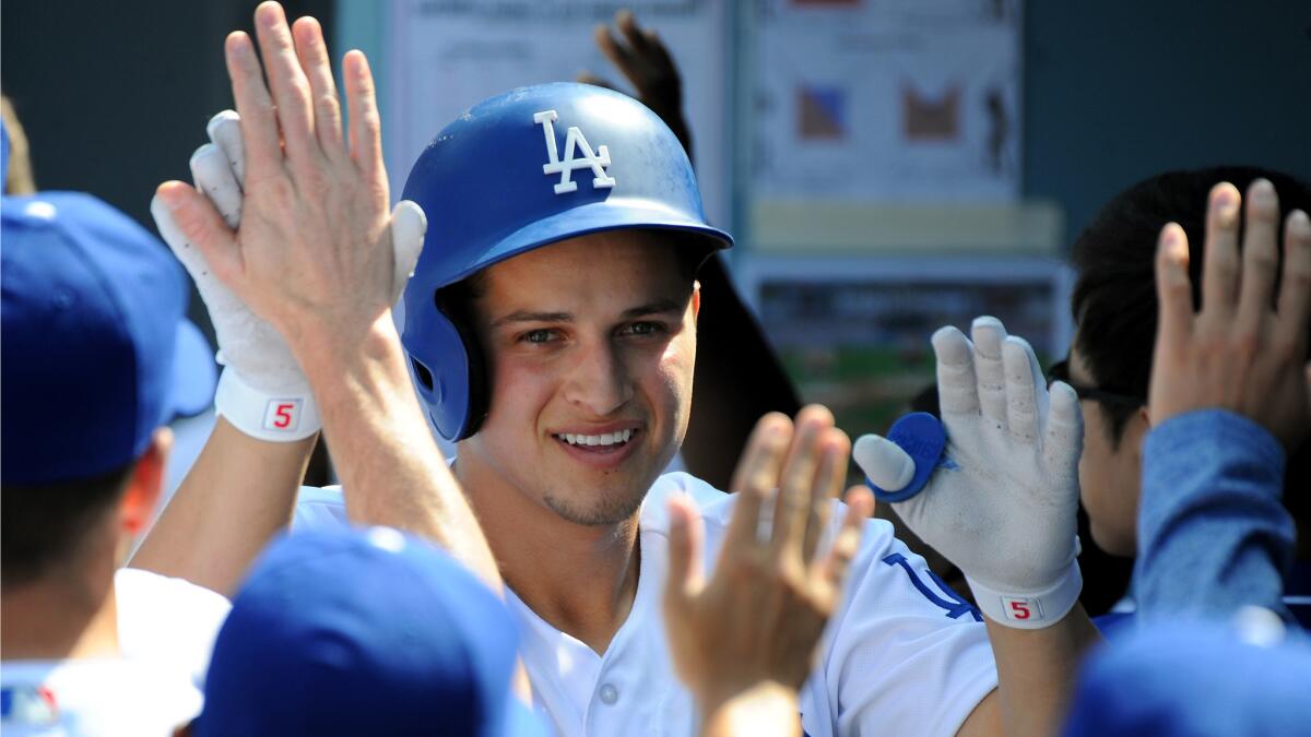 Dodgers shortstop Corey Seager is congratulated after hitting a three-run homer in the fifth inning.