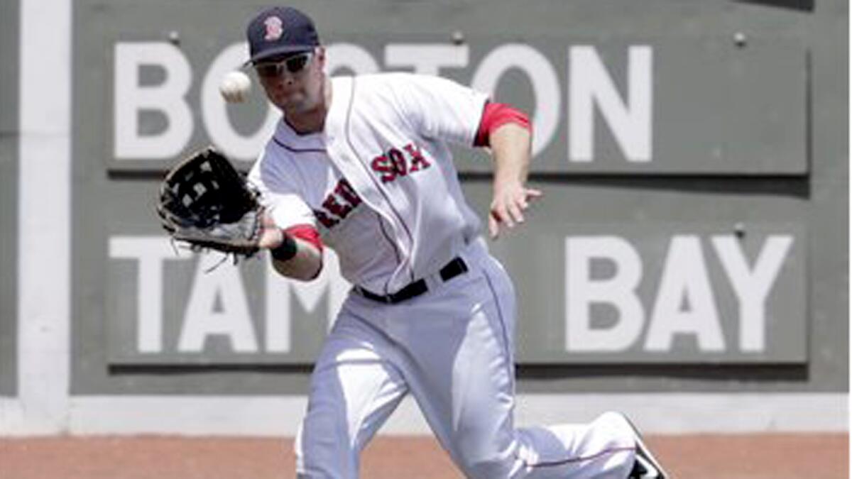 Daniel Nava makes a catch while playing left field for the Red Sox.