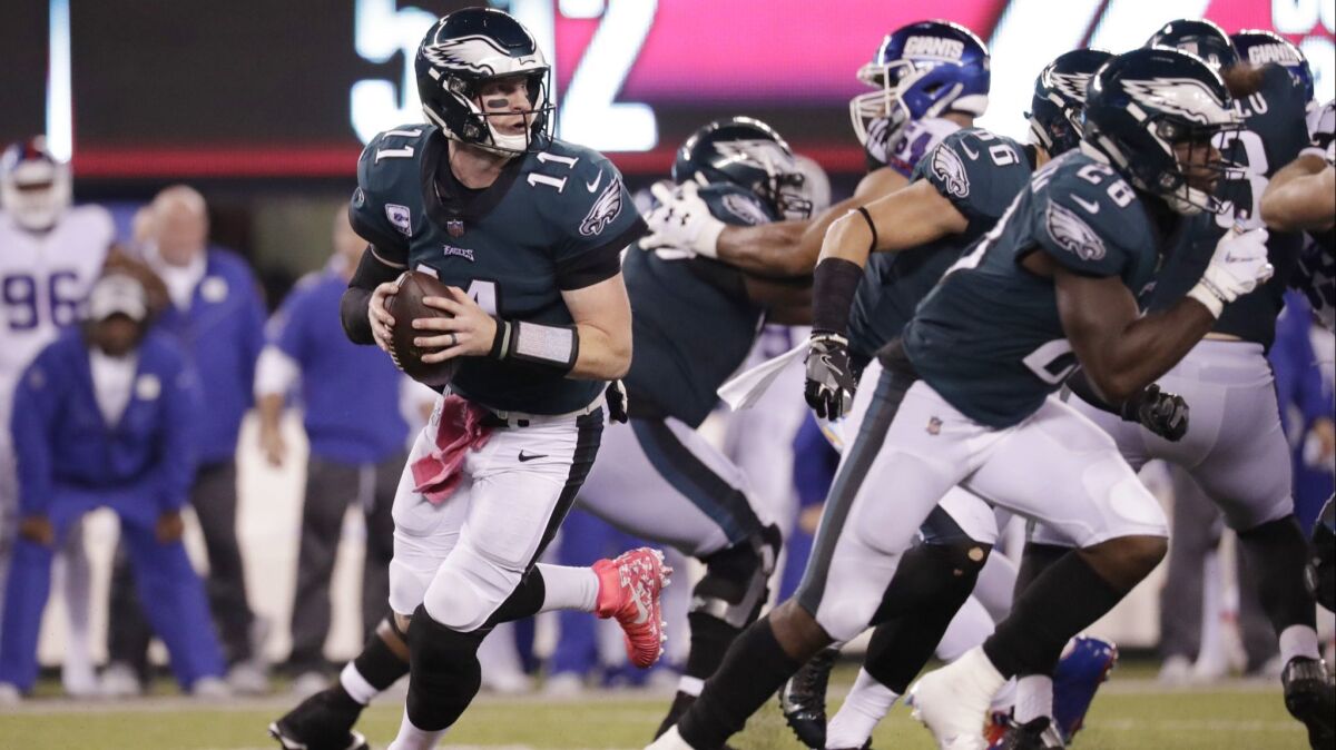 Philadelphia Eagles quarterback Carson Wentz (11) looks to pass during the first half against the New York Giants.