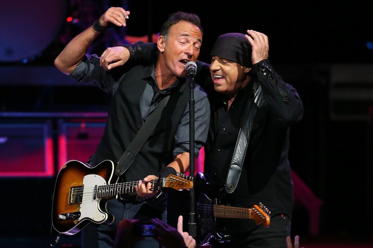 Bruce Springsteen, left, with E Streeter Steven Van Zandt, performs live for fans last week in Perth, Australia.