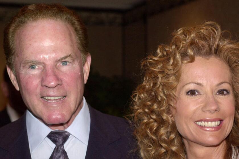 Sports announcer Frank Gifford and his wife, entertainer Kathie Lee Gifford, arrive at the New Dramatists Awards Luncheon in May 2000.