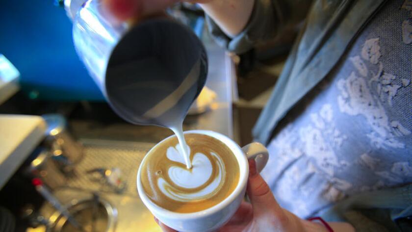 At Bird Rock Coffee Roasters in Little Italy, the lattes are as artfully made as they taste. Bird Rock is one of more than two dozen coffee shops participating in the 2017 Caffeine Crawl, which begins Friday. (Nelvin C. Cepeda / San Diego Union-Tribune)