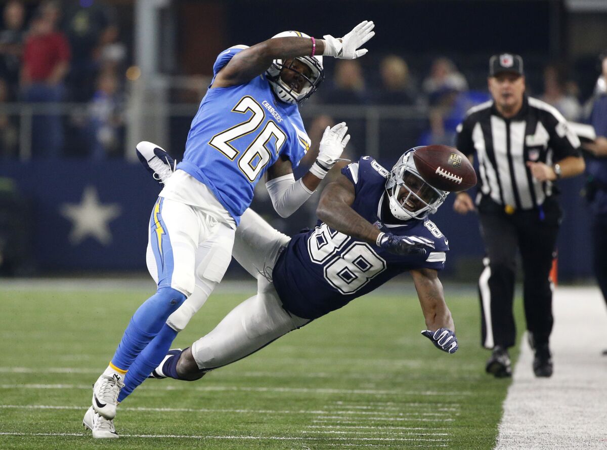 Chargers cornerback Casey Hayward (26), breaking up a pass intended for Dallas Cowboys receiver Dez Bryant last Thursday, has left the team because of his brother's death in a car accident.