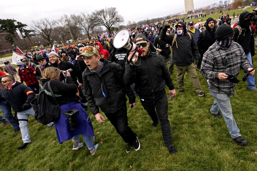 Ethan Nordean leads members of the far-right group Proud Boys in marching before the riot at the U.S. Capitol. 