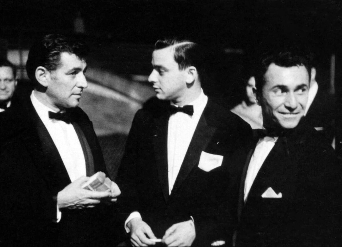 Leonard Bernstein, Stephen Sondheim and Arthur Laurents talk during  opening night of "West Side Story," Sept. 26, 1957.