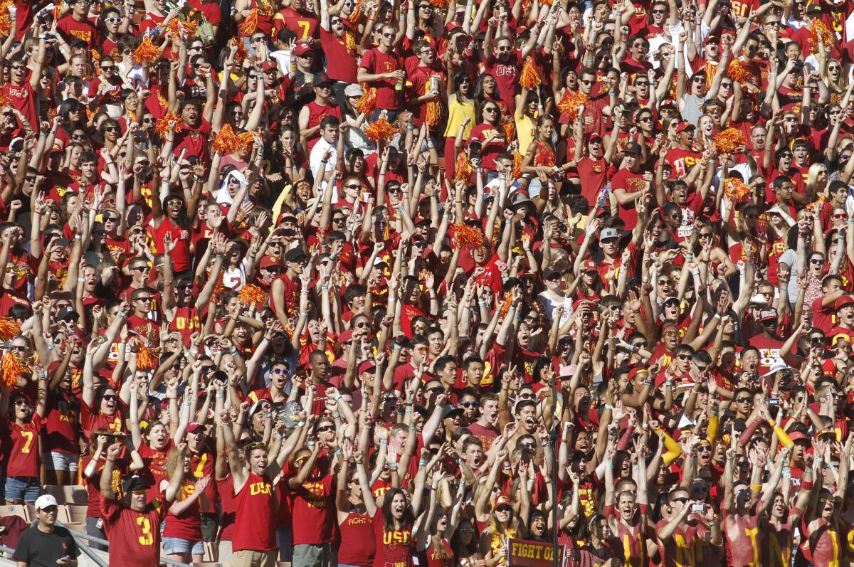 USC fans cheer at the game against Hawaii at the Los Angeles Memorial Coliseum last year.