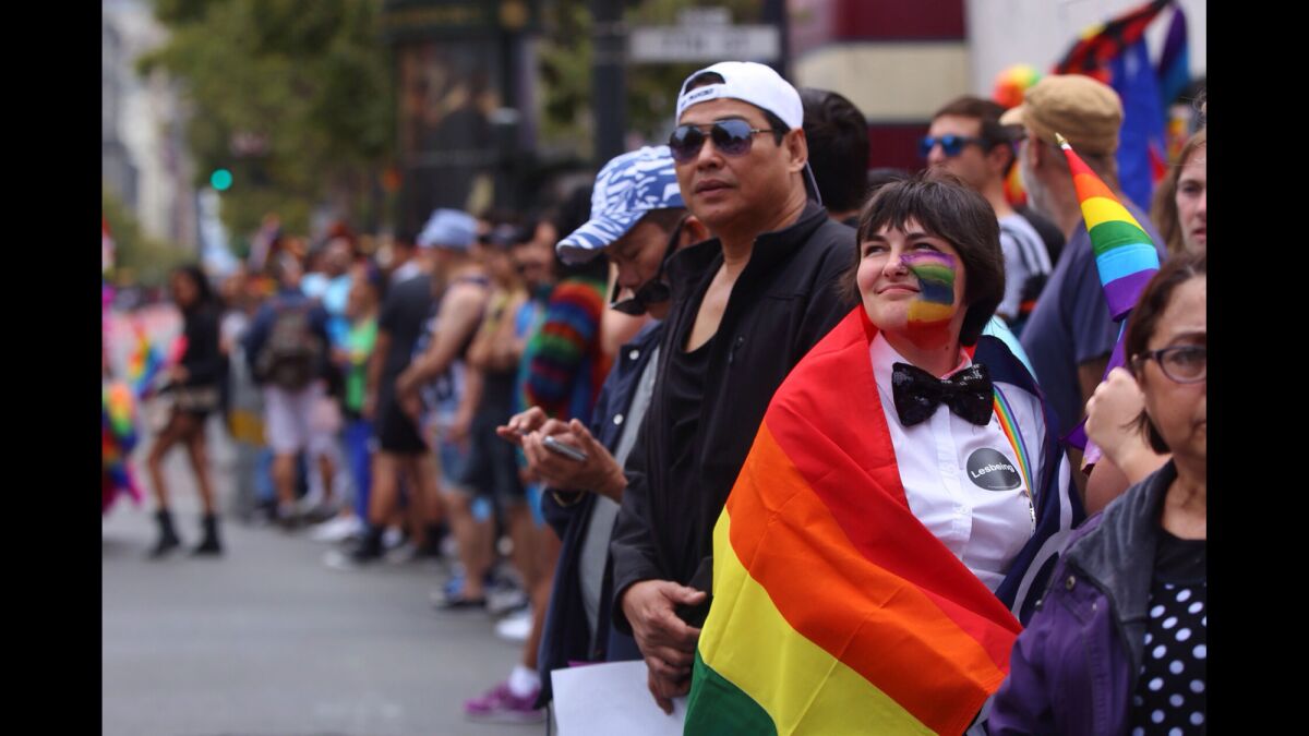 McKenna Guetersloh, of Walnut Creek, Calif., right, attends the 45th annual San Francisco Pride Celebration & Parade. Guetersloh just came out to friends and family late in 2014 and was excited to be a part of this year's event.