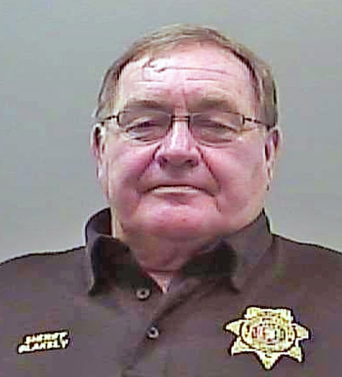 FILE - This Aug. 22, 2019, file photo provided by the Limestone Sheriff's Office shows Sheriff Mike Blakely following his arrest on theft and ethics charges, in Athens, Ala. Speaking with the media on Tuesday, Oct. 5, 2021, Blakely gave glowing reviews to the Limestone County Jail, where he spent time in custody even though he ran it for decades. (Limestone County Sheriff's Office via AP, File)