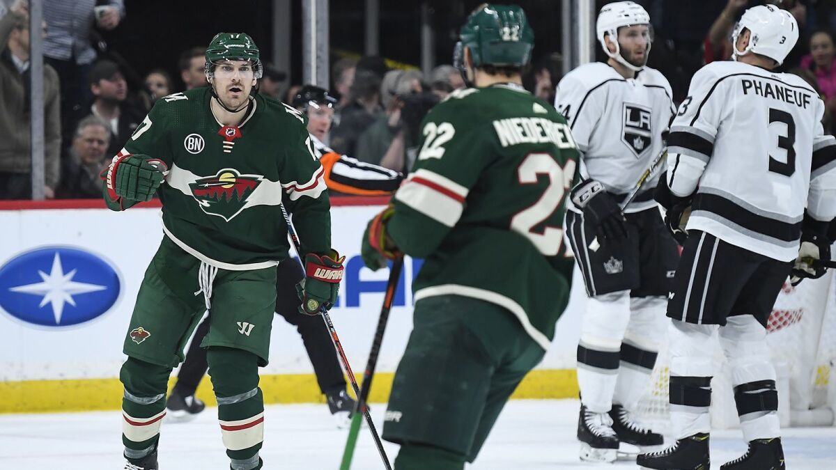 Minnesota Wild's Marcus Foligno (17) celebrates with teammate Nino Niederreiter (22) after a goal by Niederreiter in the second period against the Kings on Tuesday.