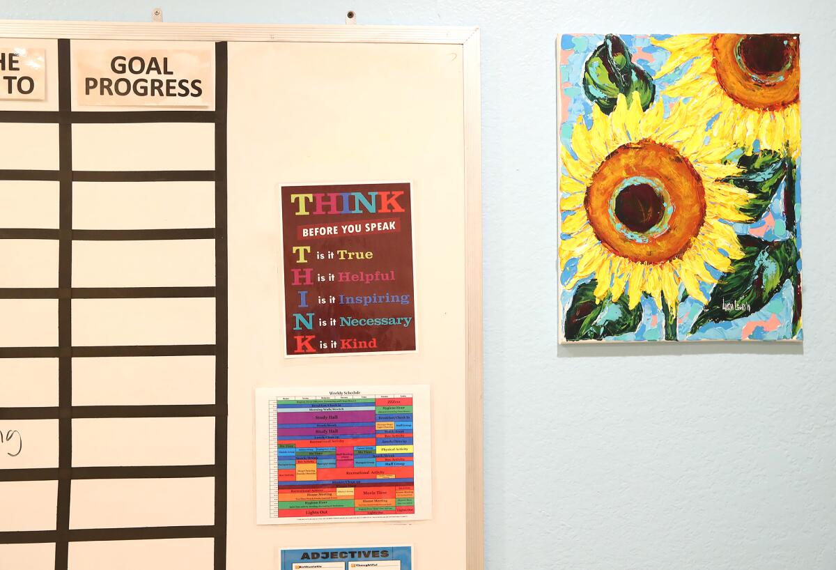 A progress chart and words of wisdom are displayed at the Waymakers Huntington Beach Youth Shelter.