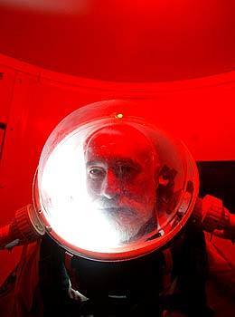 John Bergener, commander of a team of scientist and space enthusiasts at Mars Desert Research Station in Utah, under the red light of the station's air lock