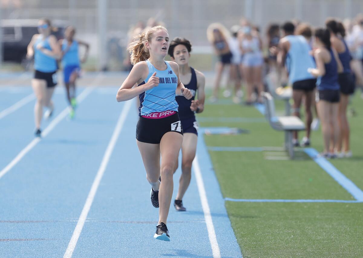 Corona del Mar's Ellie Rosing wins the girls' 1,600 meters against Newport Harbor in the Battle of the Bay on Wednesday.