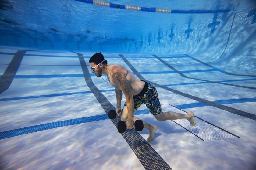 San Diego CA - January 25: During the offseason, San Diego Padres pitcher has been working out with Deep End Fitness, an underwater training program at local swimming pools run by former Marine Raiders. Here, Musgrove does breath holding drills in a pool on January 25, 2023. (K.C. Alfred / The San Diego Union-Tribune)
