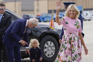 FILE - President Joe Biden looks at his grandson Beau Biden as first lady Jill Biden waves and walks to board Air Force One at Andrews Air Force Base, Md., Aug. 10, 2022. First lady Jill Biden tested positive for COVID-19 and is experiencing ‘mild symptoms’ the White House announced Tuesday. (AP Photo/Manuel Balce Ceneta, File)