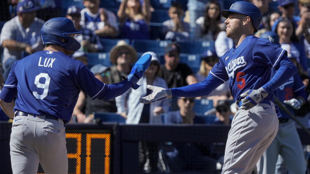 Dino Ebel returns to Dodgers third base coaches box after WBC run