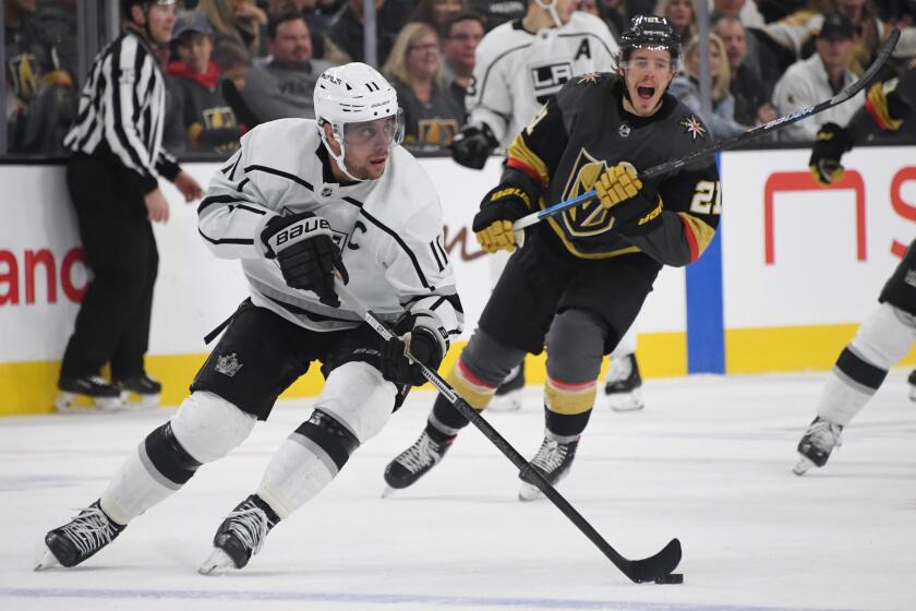 LAS VEGAS, NEVADA - MARCH 01: Anze Kopitar #11 of the Los Angeles Kings skates with the puck ahead of Nick Cousins #21 of the Vegas Golden Knights in the second period of their game at T-Mobile Arena on March 1, 2020 in Las Vegas, Nevada. (Photo by Ethan Miller/Getty Images)