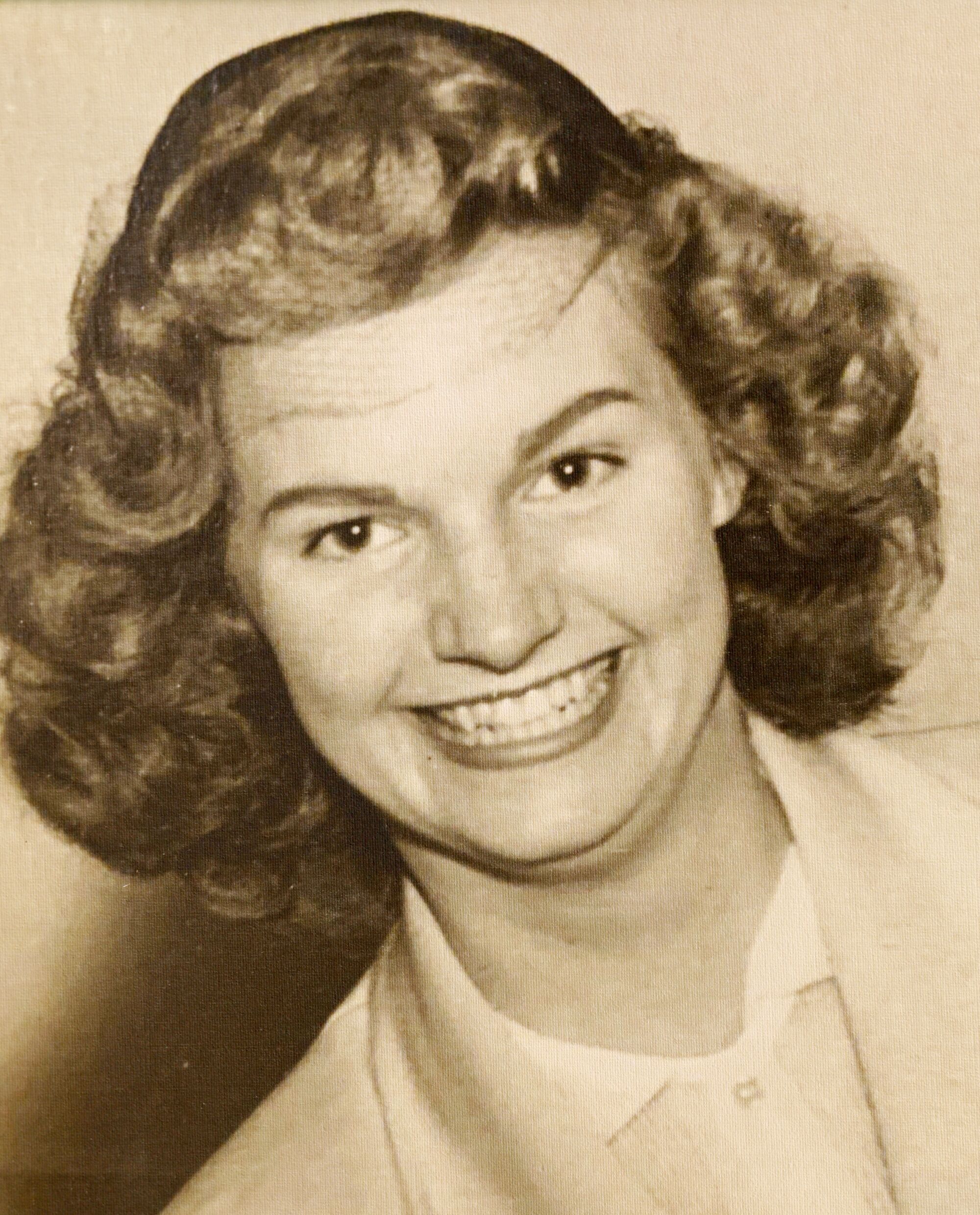Lois Woodburn, shown here in her youth, was buried at sea after her passing at age 85 in 2021.