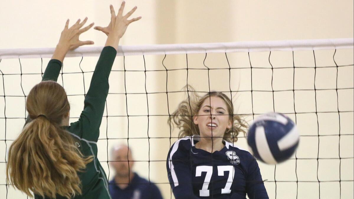 Calvary Chapel High's Mackenzie Hill (77) records one of her 11 kills in an Orange Coast League match against Costa Mesa on Tuesday.