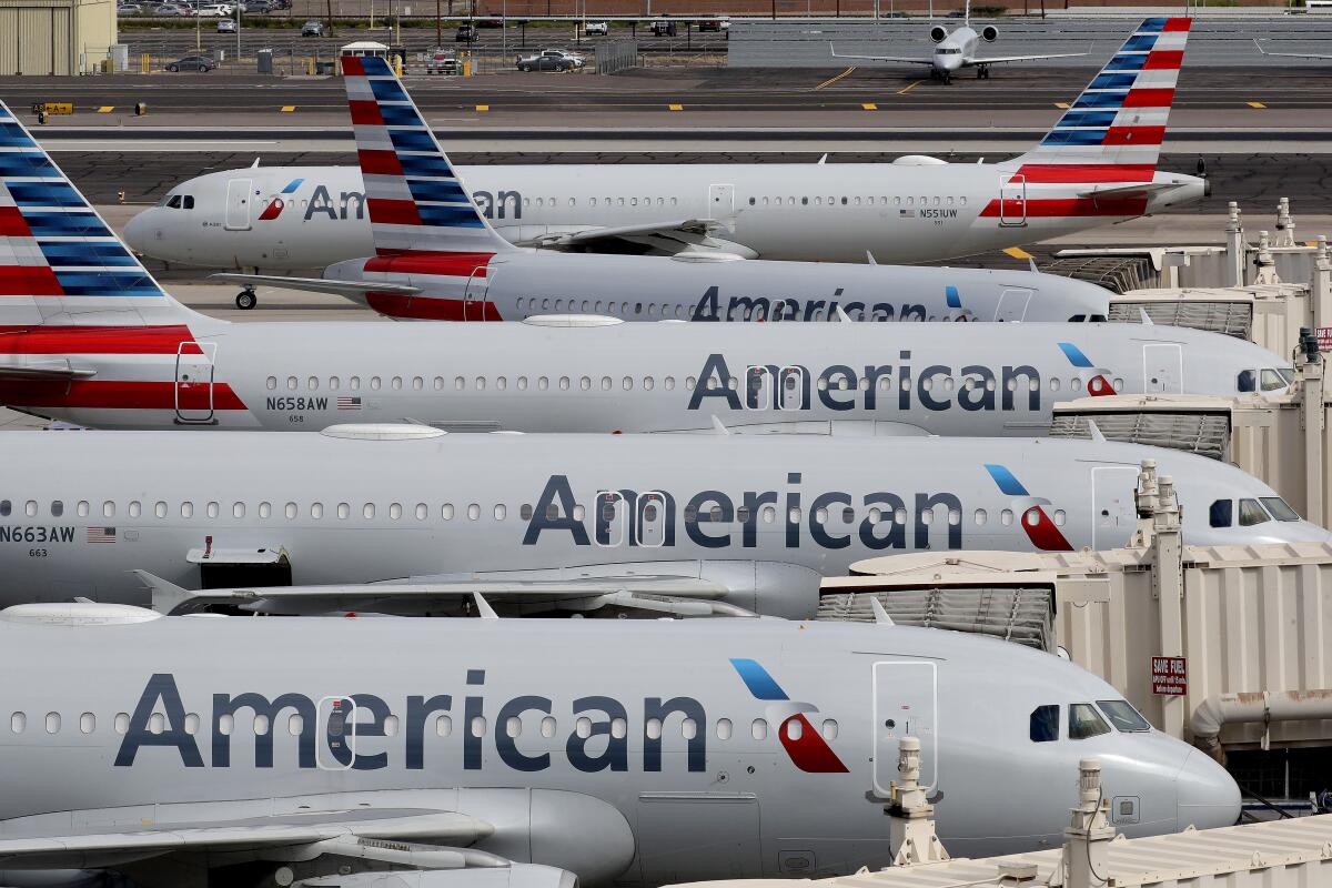 American Airlines jets sit at their gates at Sky Harbor International Airport in Phoenix. 