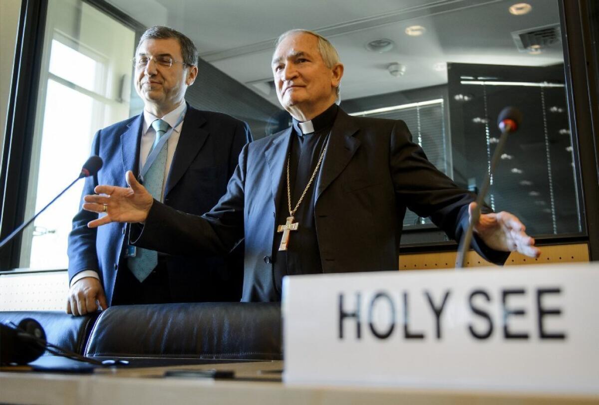The Vatican's ambassador to the United Nations Monsignor Silvano Tomasi, right, gestures next to Vatican Secretary of State Monsignor Christophe El-Kassis, left, during a hearing before the United Nations Committee Against Torture on Monday.