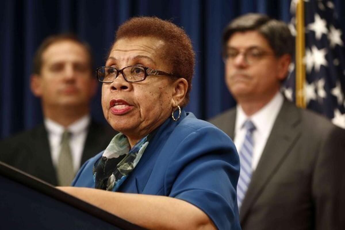Acting Social Security Commissioner Carolyn W. Colvin, center, accompanied by Acting Labor Secretary Seth D. Harris, left, and Treasury Secretary Jacob Lew, speaks during a news conference about Social Security and Medicare at the Treasury Department in Washington on Friday.
