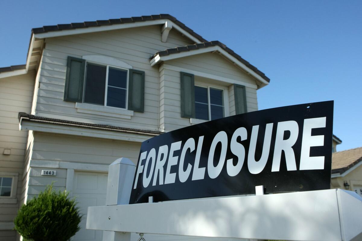 A foreclosure sign sits in front of a home in Stockton.