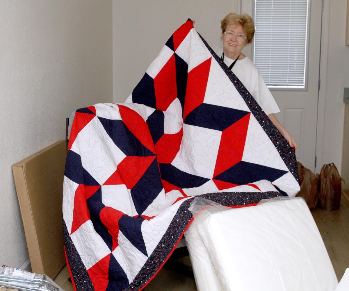 Shirley Pratt of the Foothill Civitan Club of Burbank made a quilt for one of the bungalows at a homeless veterans housing project on Verdugo Ave. in Burbank on Saturday, Dec. 19, 2015.