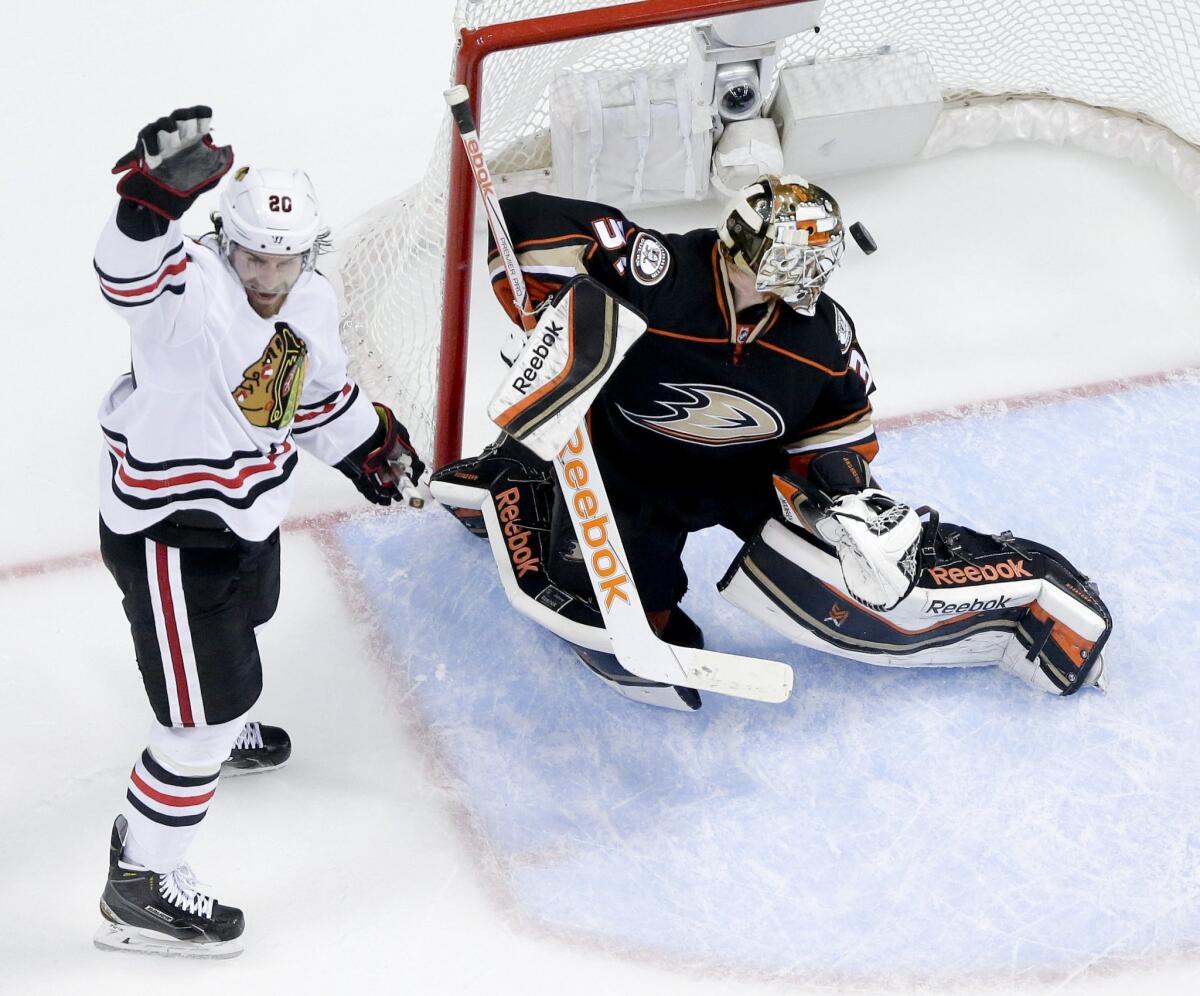 Chicago left wing Brandon Saad, celebrates teammate Jonathan Toews' goal past Ducks goalie Frederik Andersen during Game 5 of the Western Conference finals on Monday.